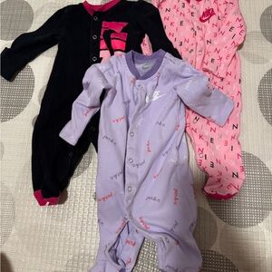Nike Kids One Piece Footies - Black, Pink, and Purple
